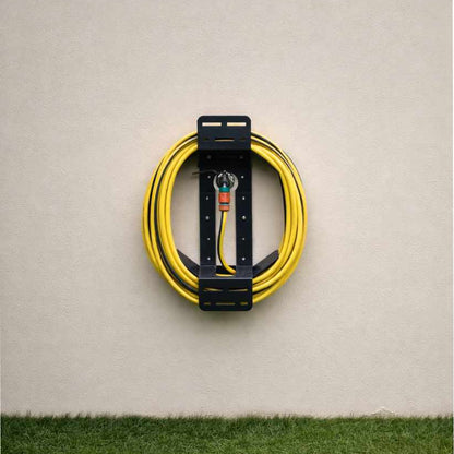 Coiled yellow cable with a black holder on a beige wall.