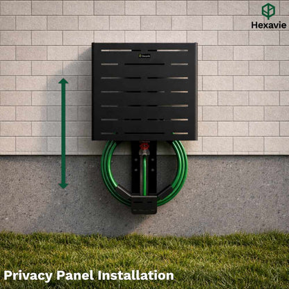 Hexavie privacy panel installation on a wall with a hose attached, grass at the bottom.