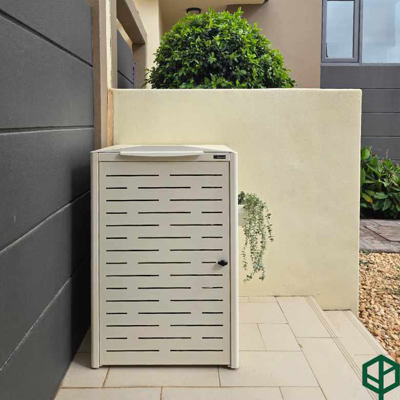 Beige outdoor storage unit with a textured design on a patio area.